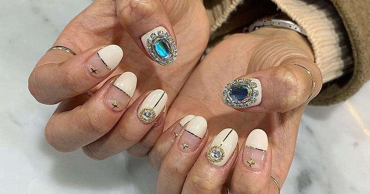 Detailed and elegant nail art design showcasing creativity and intricate crafting for beauty enthusiasts.
