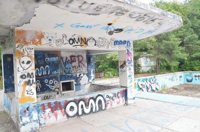 Scenic view of the pool area at Seoul National University during a BTS music video shoot, highlighting the surrounding nature.