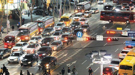 Heavy traffic jam in Gangnam at 10 PM as parents rush to pick up children from cram schools.