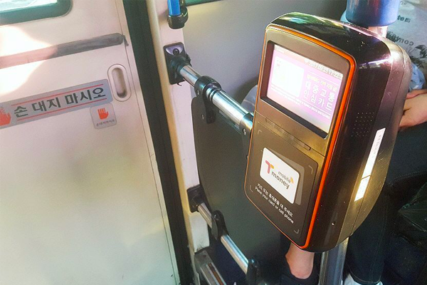 T-money card reader on a Korean bus, essential for tapping in and out during rides in Korea.