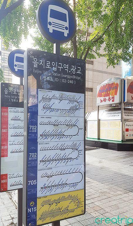 Seoul bus stop with real-time display showing bus arrival times.