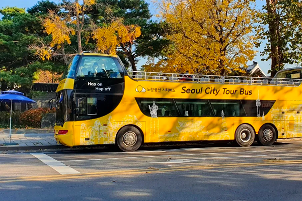 Tourist double-decker bus in Seoul offering unlimited rides around city center attractions with luxurious seating.