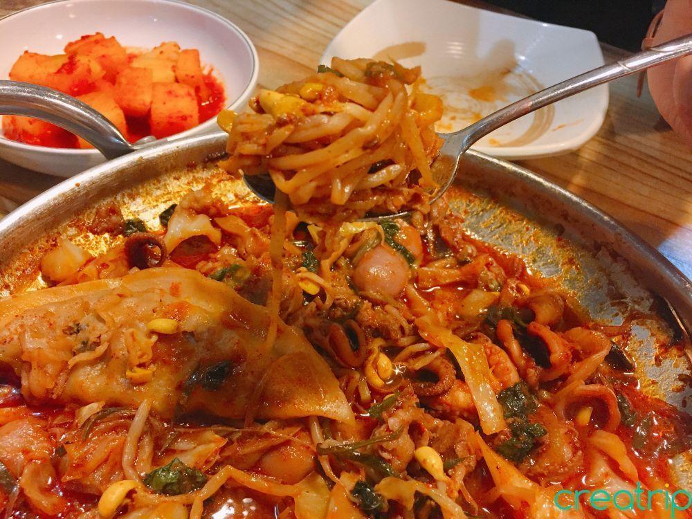 Small beef slices and octopus pair perfectly with vegetables at Fatty Octopus restaurant, creating a delightful dish.