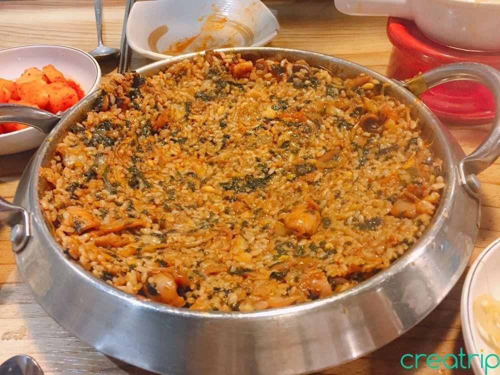 Delicious fried rice being prepared at Fatty Octopus restaurant with leftover ingredients.