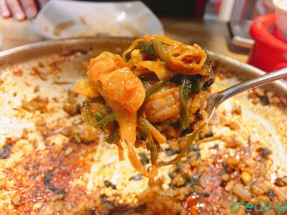 Fried rice topped with small beef slices and octopus at Fatty Octopus restaurant in Myeongdong.