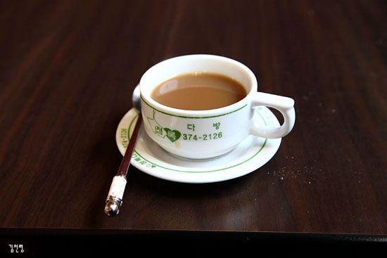 Cup of traditional Dabang coffee served in a classic cup and saucer, capturing the essence of Korean coffee culture of the 1970s.