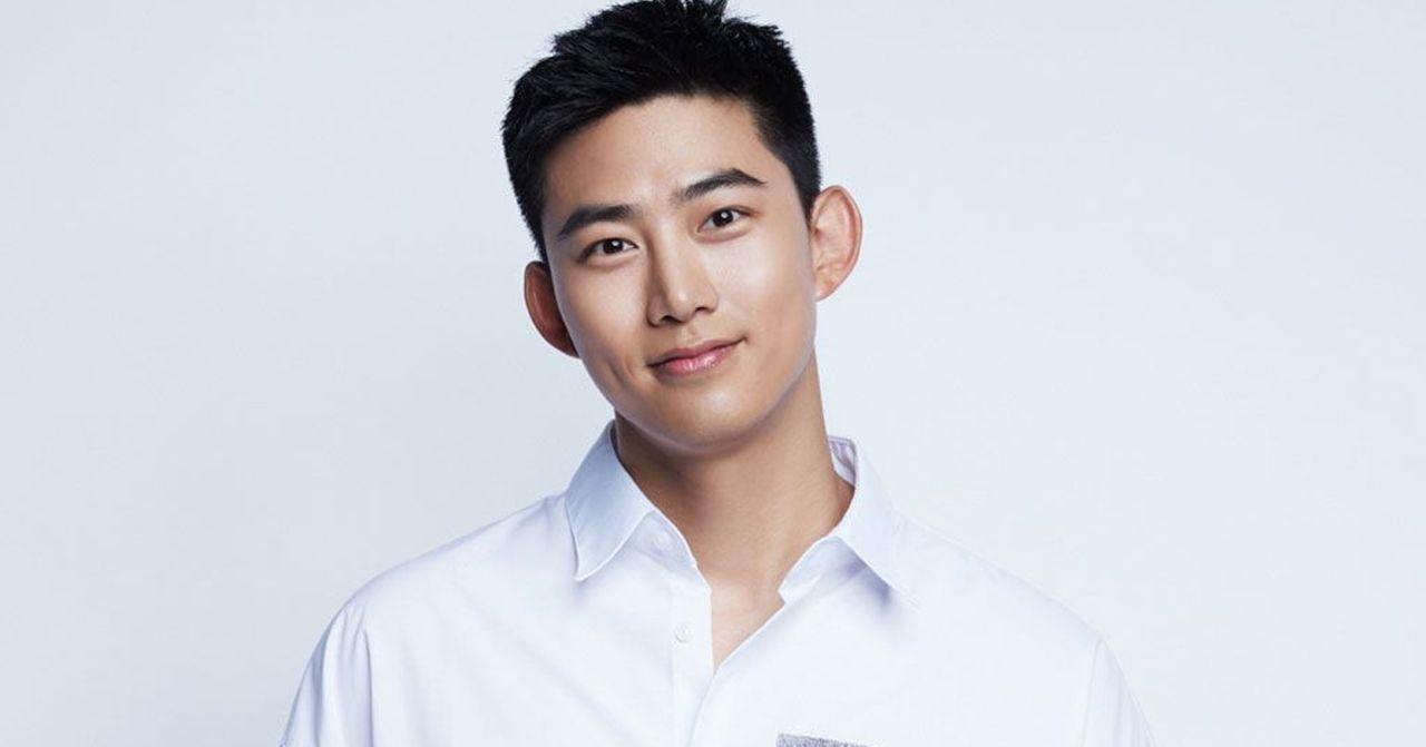Taiwanese actor starring in a portrait session, wearing a white shirt.
