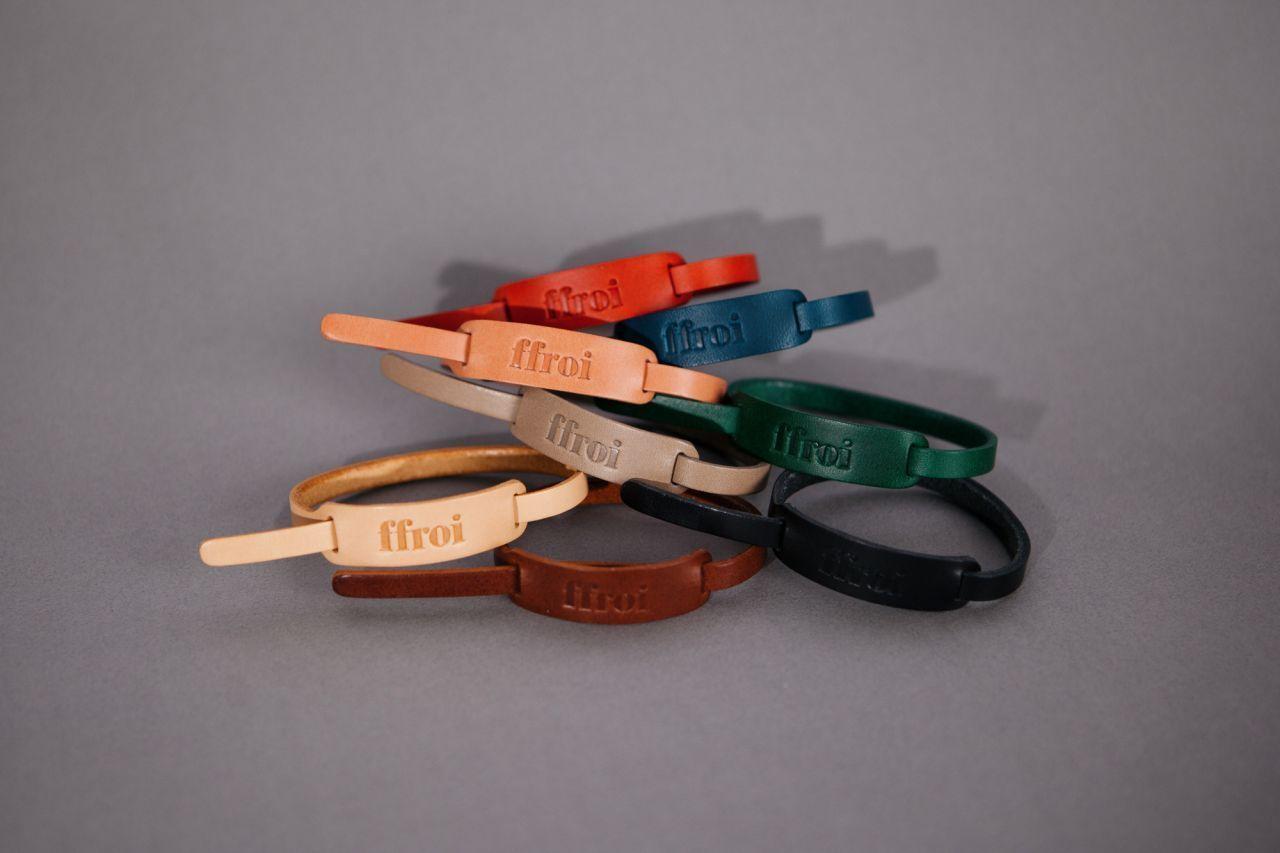 A collection of handmade leather bracelets by ffroi in various bright colors, highlighting the brand's emphasis on quality and style.