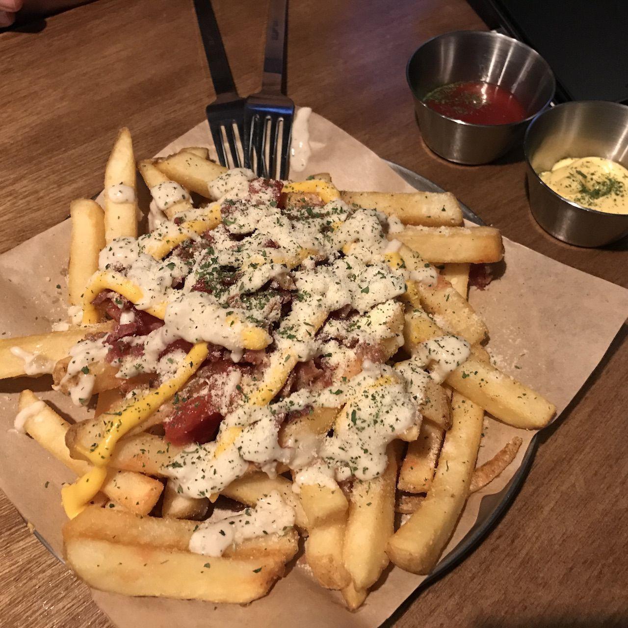 Cheese fries at Liquid Lab, Seongsu-dong, drizzled with savory sauces making it a perfect complement to craft beer.