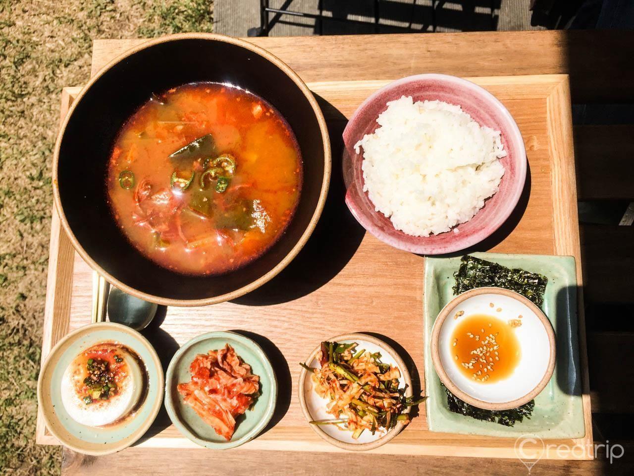 A well-arranged meal from Grandma's Recipe in Seongsu-dong, served with various colorful Korean side dishes and rice.