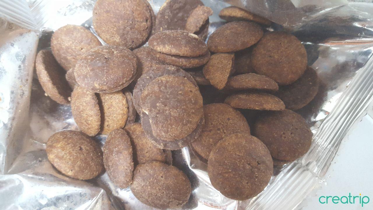 Inside view featuring round chocolate moon-shaped cookies; a delightful sweet snack.