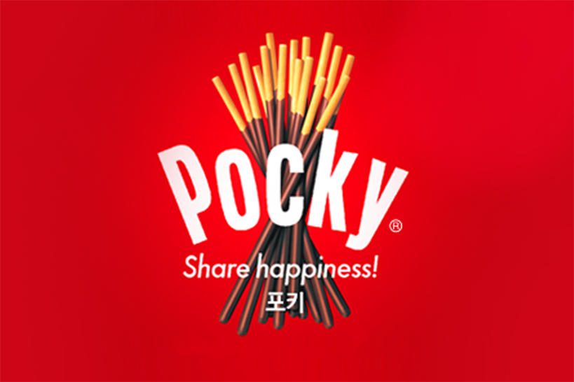 一个Pocky商品的广告，背景是红色的、简单的产品设计，呼吁分享快乐。