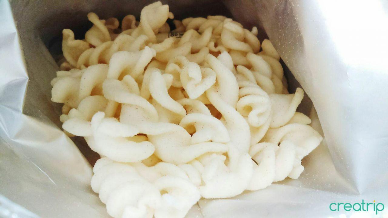 Interior view of CU garlic-flavored Italian pasta snack showing spiral chips