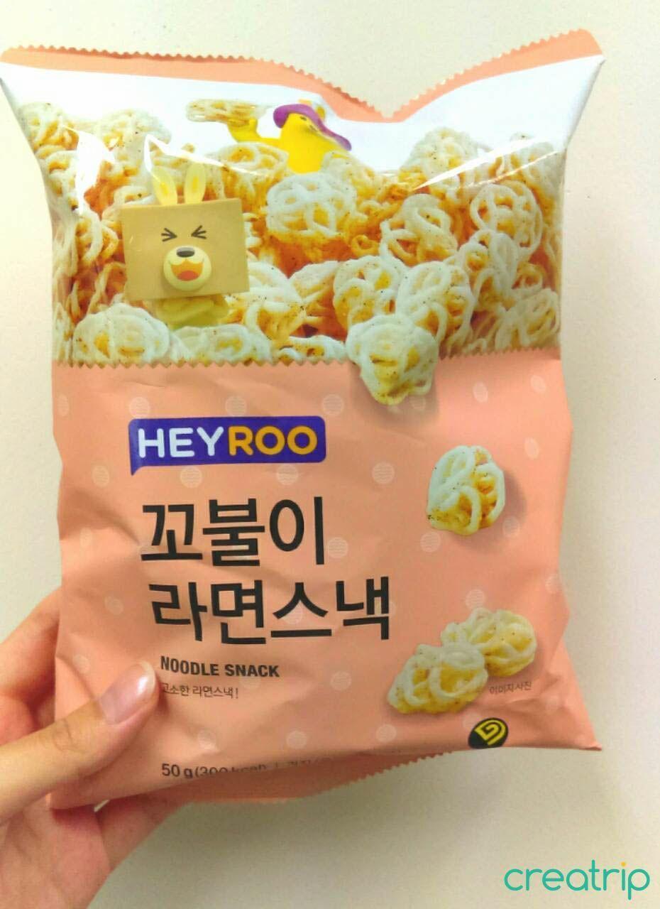 Noodle-shaped snack packaging from CU convenience store featuring cartoon illustrations