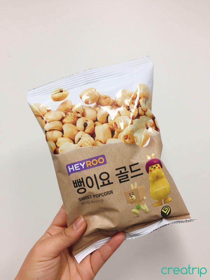 CU branded popcorn snack packaging with cartoon illustrations, Korean convenience store product