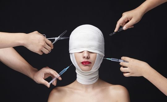 A model wrapped in bandages surrounded by surgical tools, symbolizing the widespread practice and normalization of cosmetic surgery in Korea.