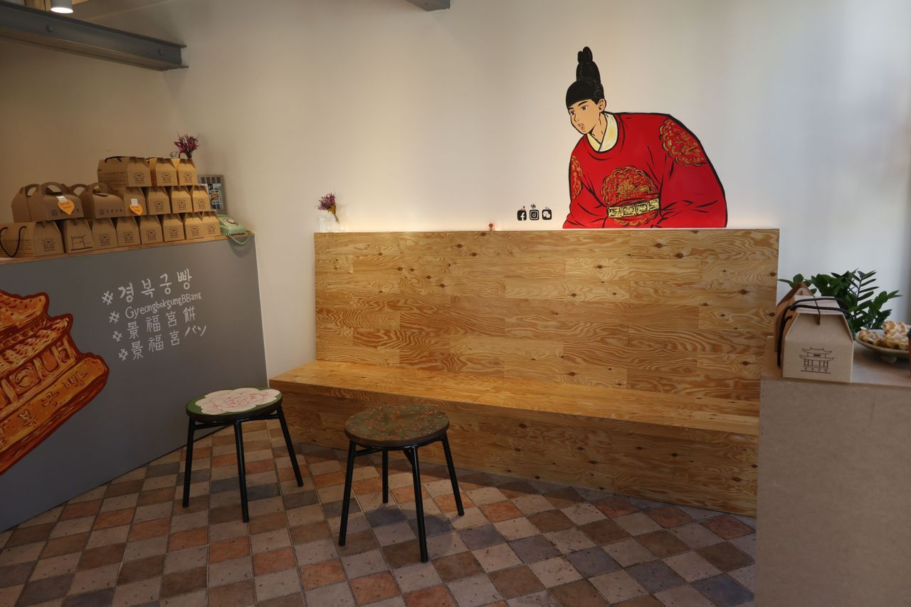 Gyeongbokgung Bbang café interior showing seating area with Korean traditional motif