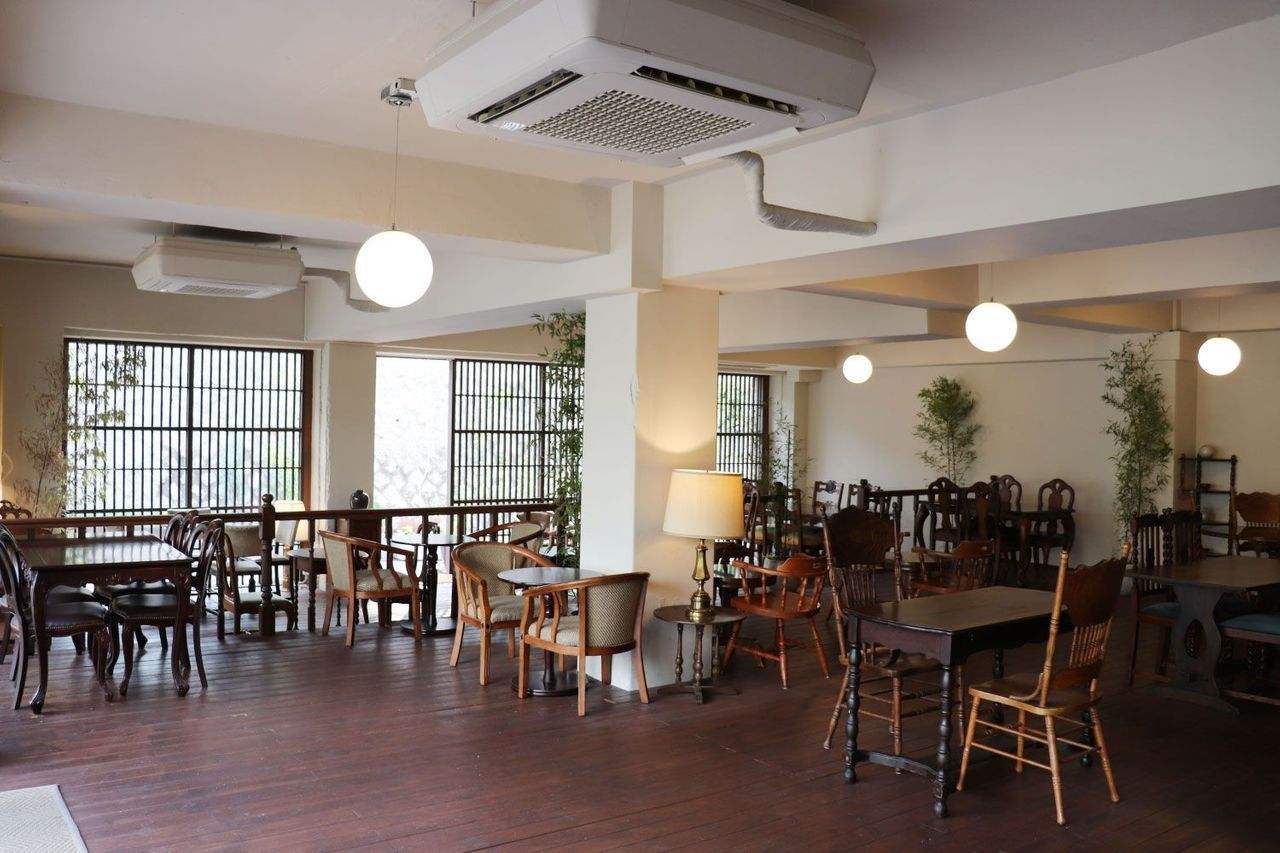 Interior of Gabaedo Samcheongdong cafe featuring wooden furniture and cozy ambiance