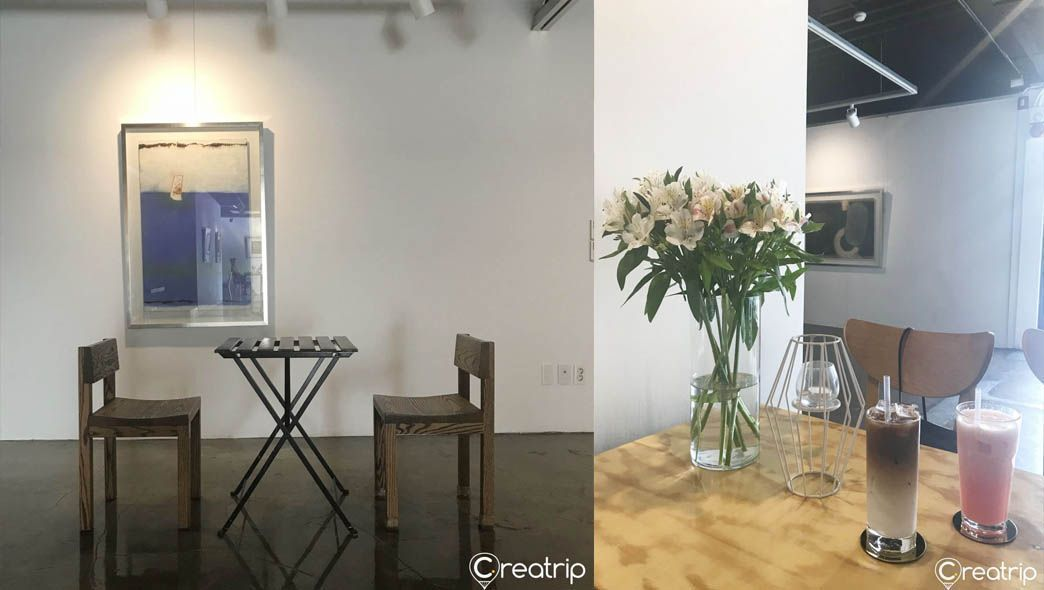 Elegant cafe and gallery space at Cafe 88st with floral arrangements and beverages on a table