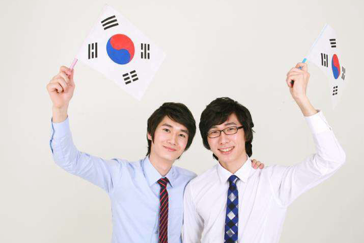 Illustration of two people waving South Korean flags, depicting national pride and collective identity in South Korea.