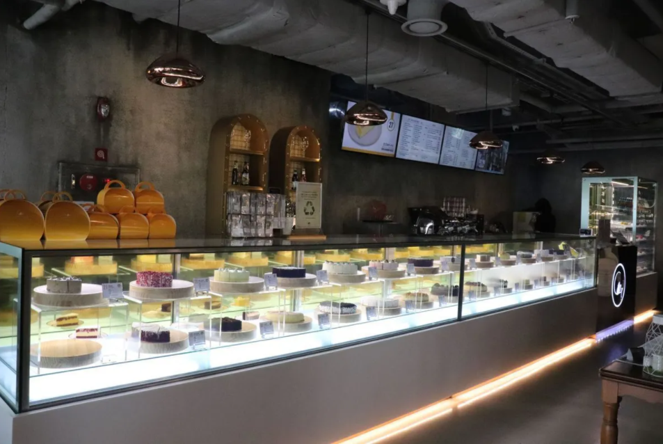Exquisitely detailed cheesecake display inside C27, a beloved spot for dessert enthusiasts in Hongdae.