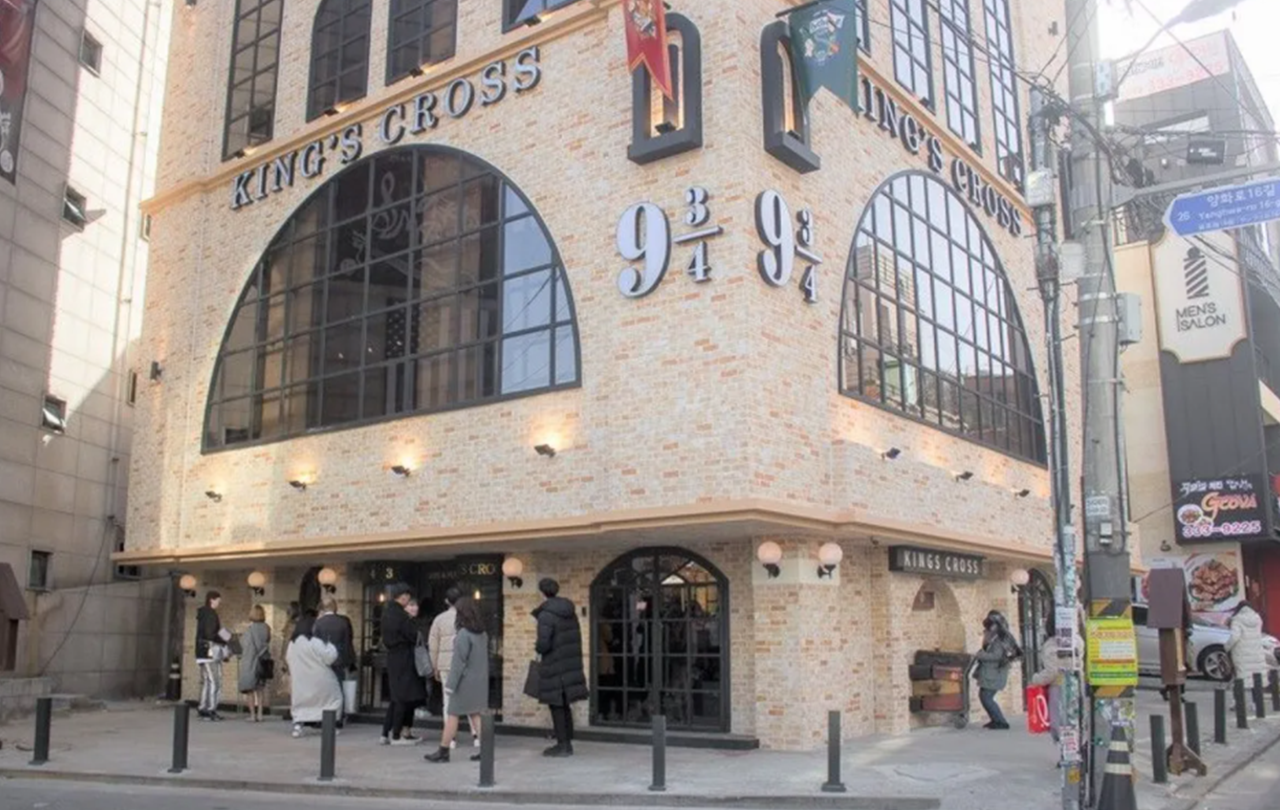 Exterior view of 943 King's Cross, a Harry Potter-themed cafe in Hongdae, bringing the magic to life in Seoul.