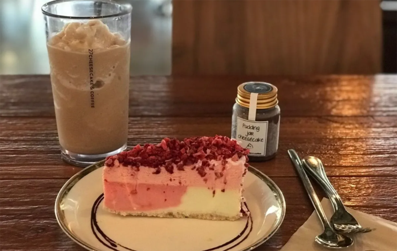 Flavorful and visually appealing cheesecake dessert paired with a creamy iced drink at C27 in Hongdae.