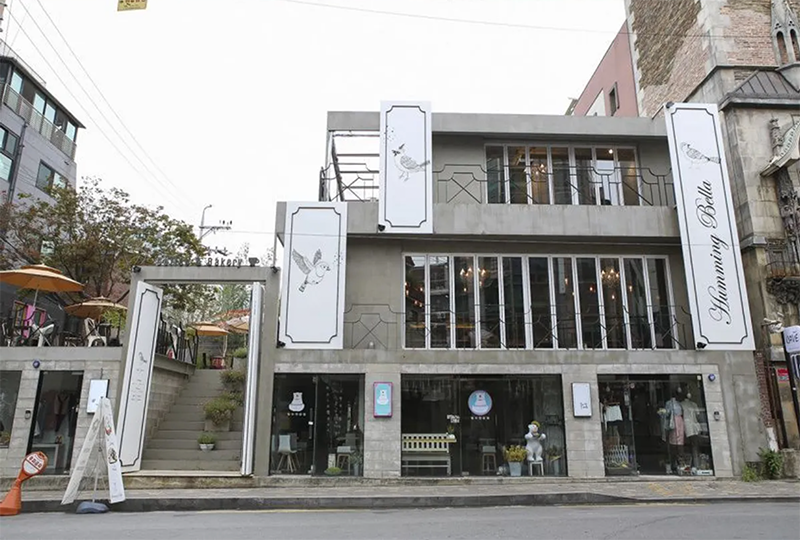 Humming Bella cafe in Hongdae with its distinctive architectural design and three-story layout.