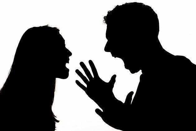 Silhouette image of a couple in an argument, illustrating conflict in relationships.