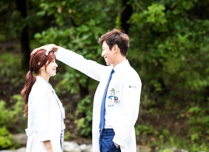 Korean couple sharing intimate moment on a TV show, illustrating modern relationship dynamics.