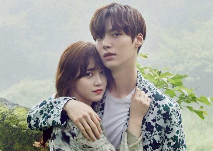 Couple embracing in a natural setting, symbolizing love and connection in Korean culture.