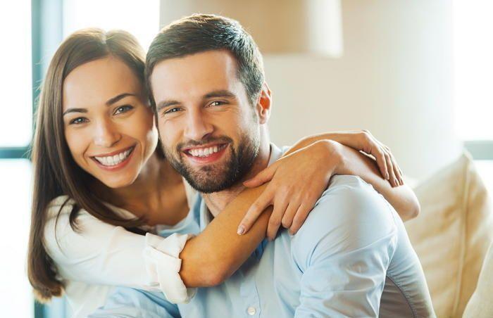 Couple sharing a close moment with affectionate poses, representing modern relationships.