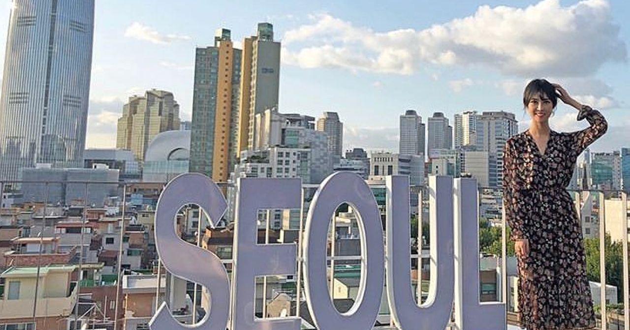 Cityscape view from a rooftop in Seoul with prominent lettering and urban city backdrop capturing metropolitan beauty.