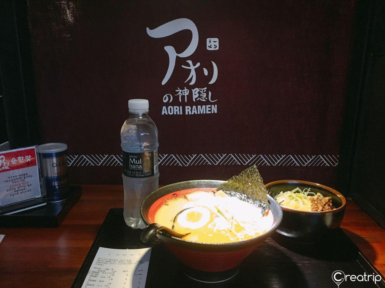 Ramen dishes served at Aori Ramen, including soft-boiled egg and seaweed topping
