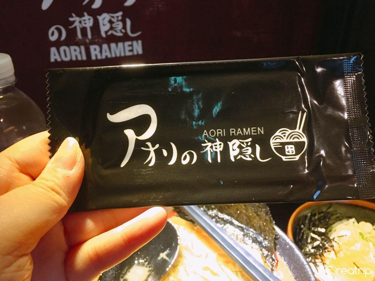 Wet wipe handed out at Aori Ramen for customer convenience