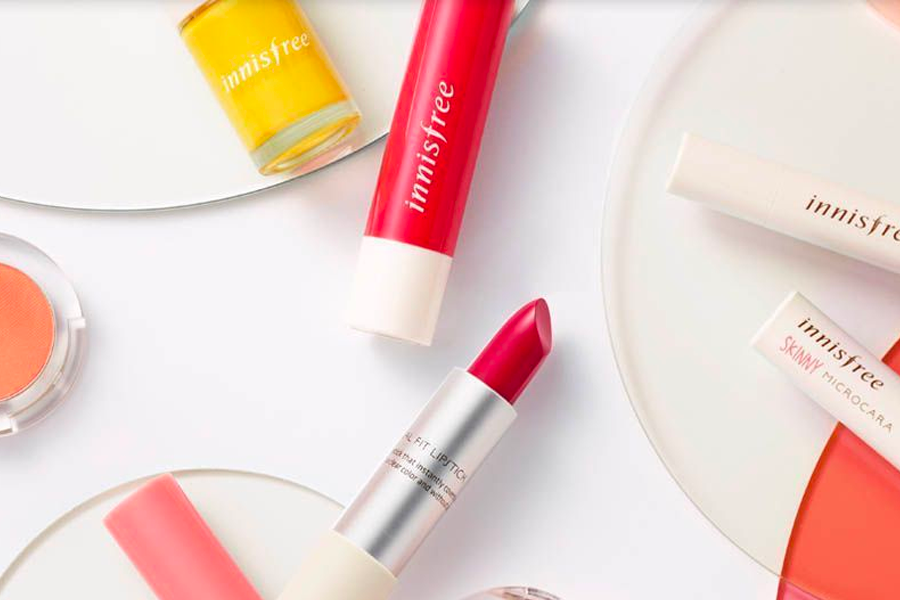 Selection of Korean eye and lip beauty products including vibrant lipsticks and eye shadow palettes.