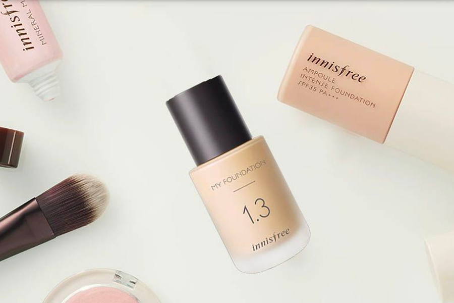 A collection of Korean foundation makeup products showcasing various shades and applicators.