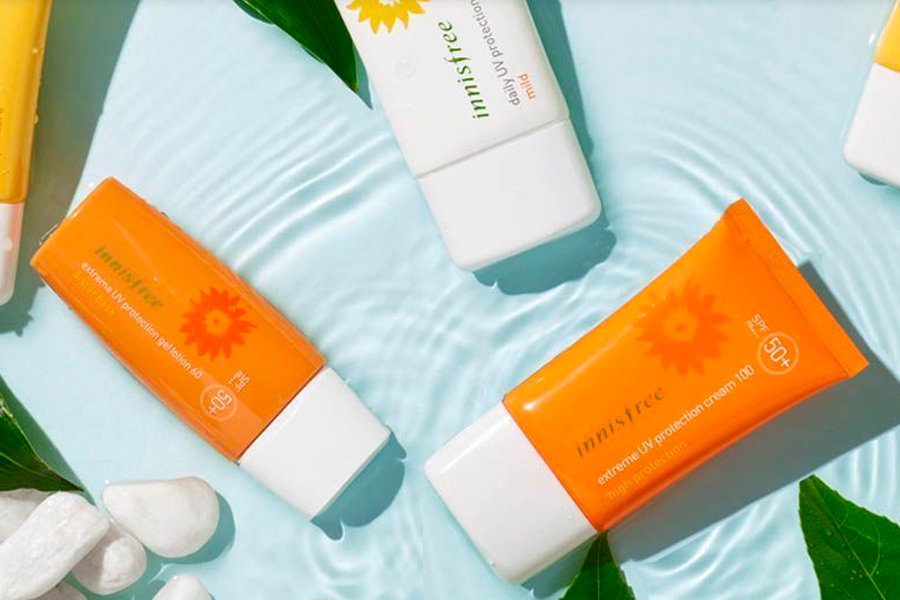 Innisfree sunscreen products displayed with summer vibes, including vivid sunscreen sticks and tubes.