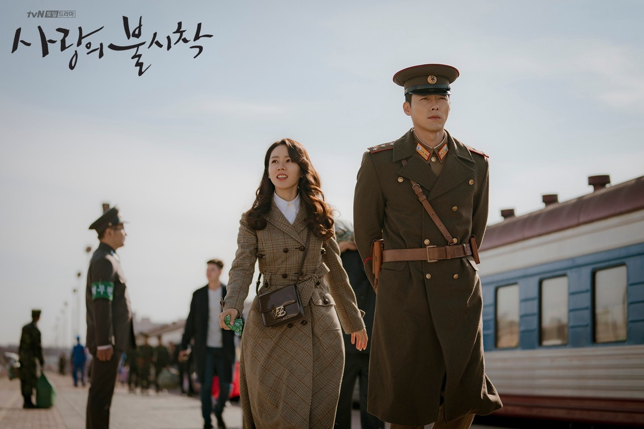 Scene from Korean drama 'Crash Landing on You' depicting military officers in North Korean setting