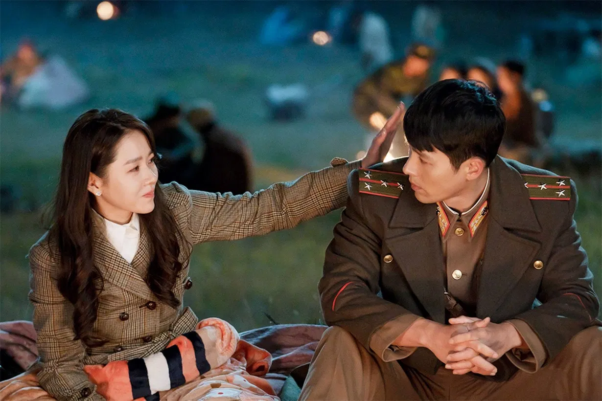 Scene from 'Crash Landing on You' showing romantic tension and cultural barriers between North and South Korea