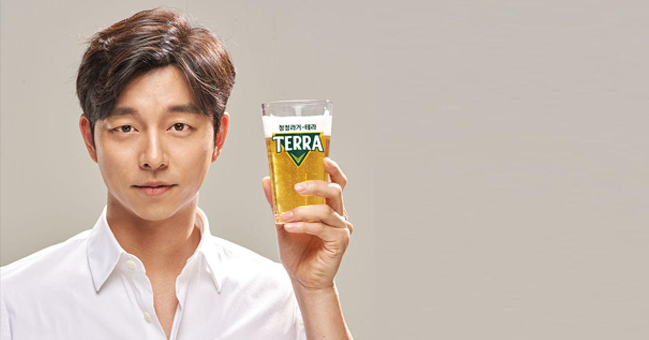 Celebrity endorsing Korean beer brand, showcasing pop culture influence