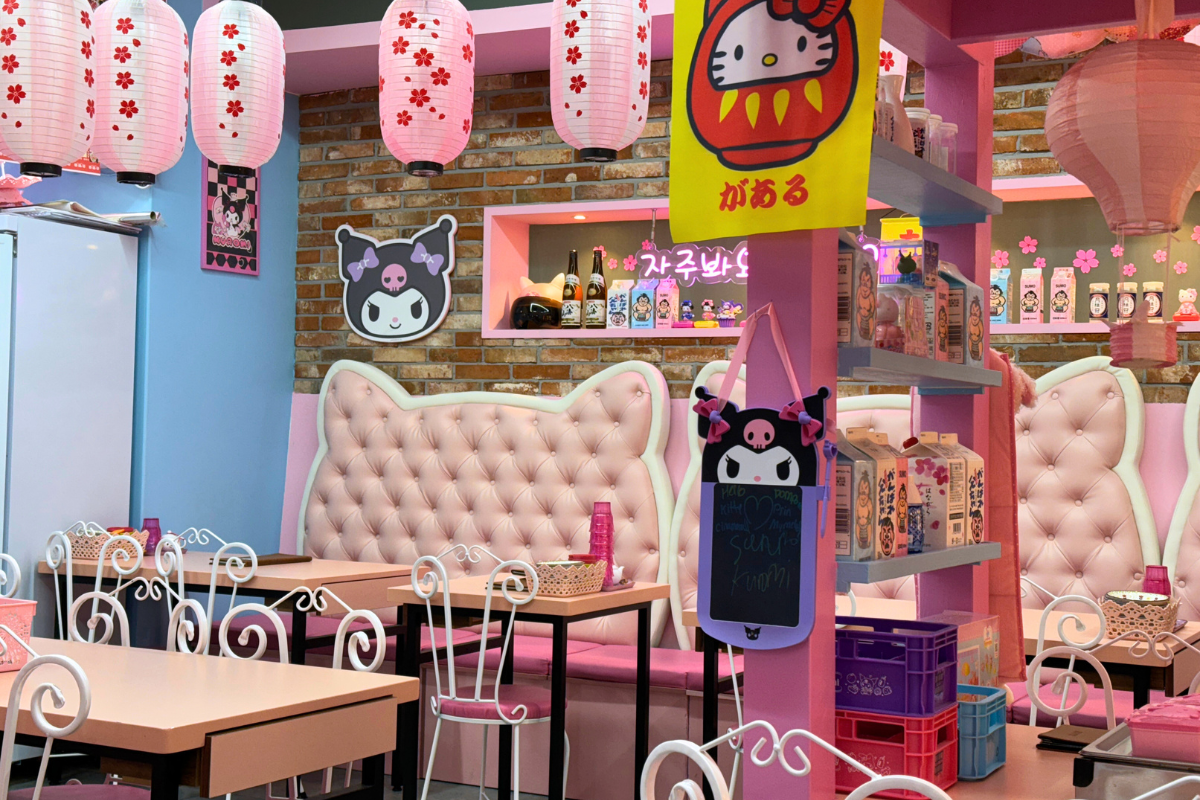 Sanrio-themed interior of Eunhaeng Gol Sushi in Myeongdong, Seoul, featuring Hello Kitty decorations and plush seating.