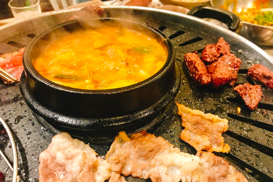 Pouring soju, a typical Korean alcohol, to be paired with 삼겹살 during Korean BBQ gatherings