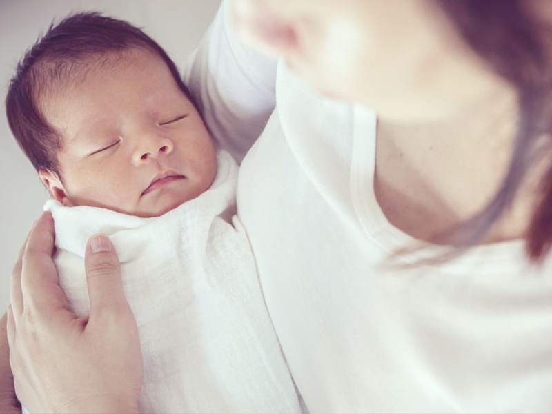 mother holding a newborn baby