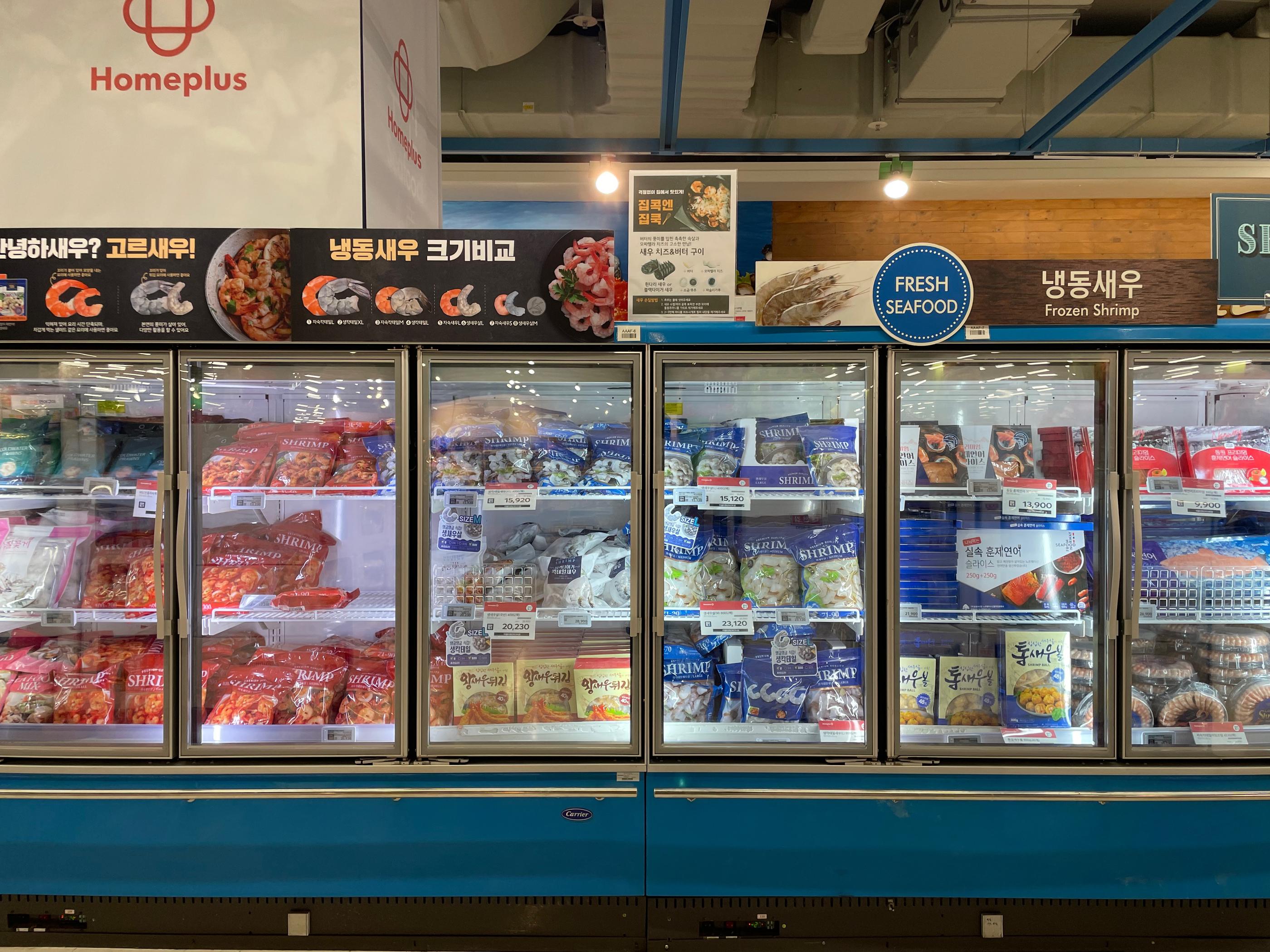 Frozen shrimp section inside Homeplus Hapjeong, labeled 'Fresh Seafood'
