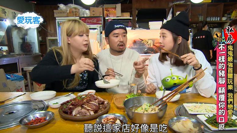 Diners at Jokbal restaurant taste various dishes, highlighting the delicious Korean culinary experience.