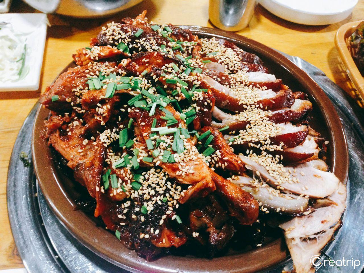Takeout counter at Jokbal restaurant offering neatly packed meals for to-go orders.