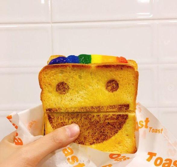 The front of Jokbal restaurant '족발귀신', capturing the vibrant lights and welcoming entrance.