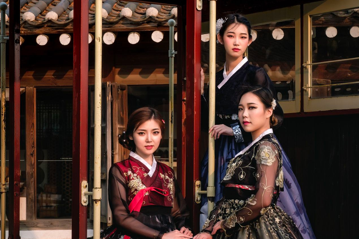 InKorea Hanbok store interior with various Hanbok sizes and styles displayed.