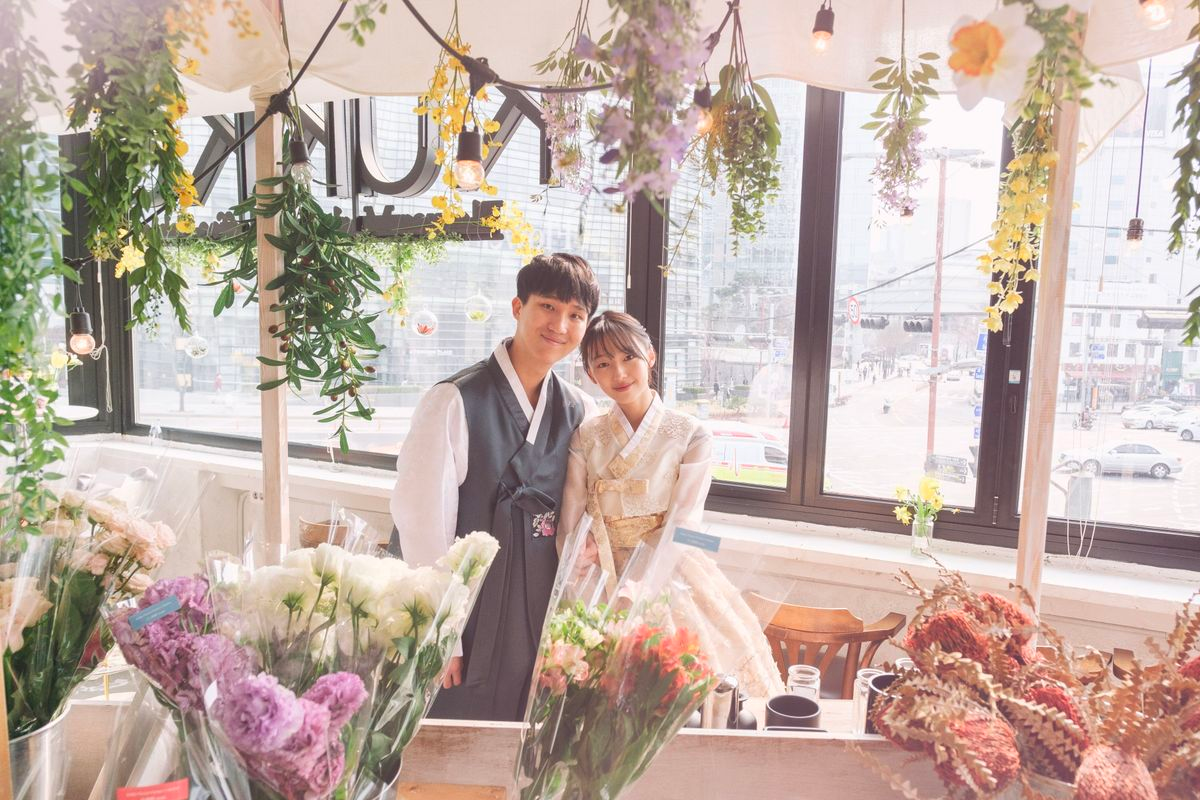 Vibrant Hanbok skirts in pastel tones hanging together at InKorea Hanbok shop in Seoul.